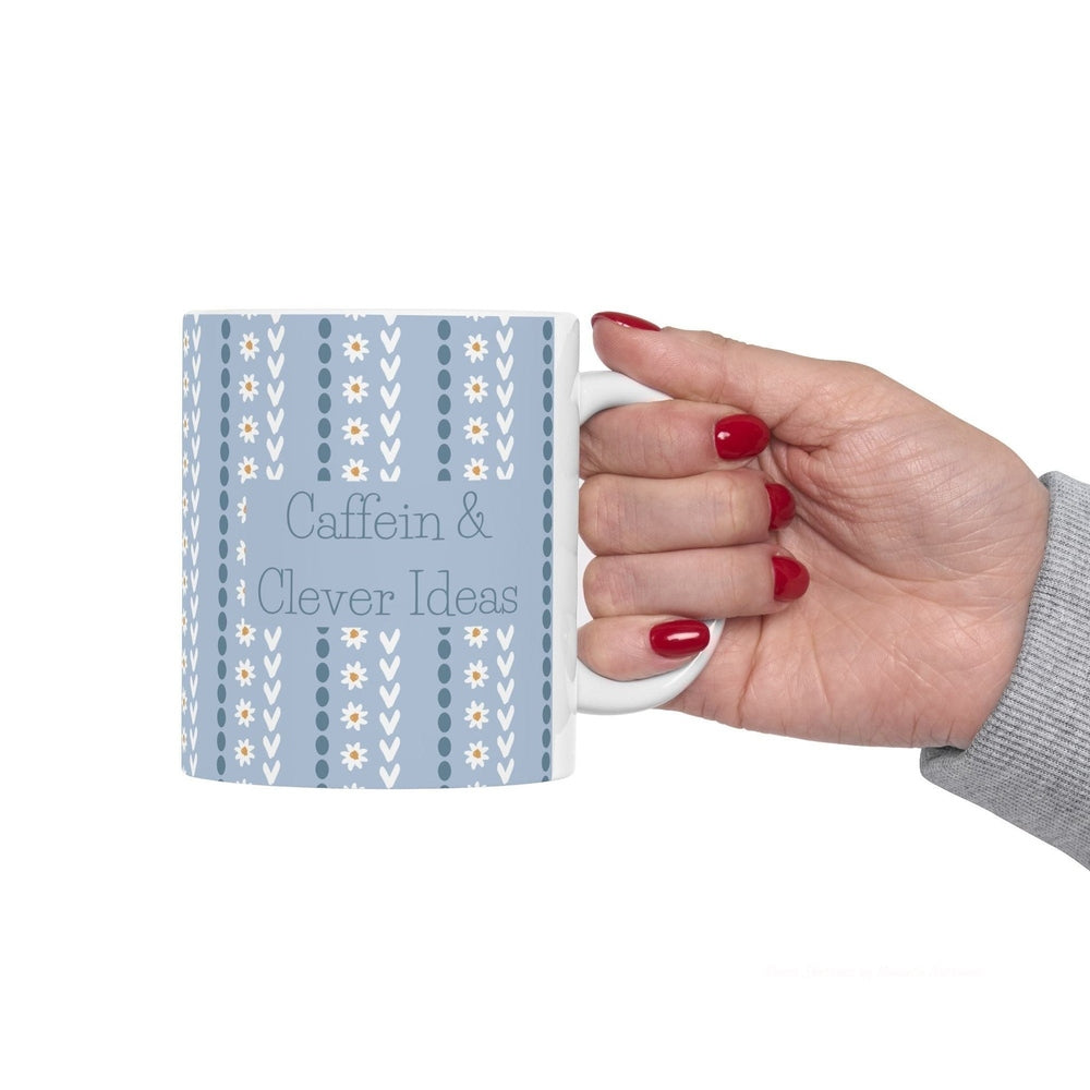 funny blue and white floral mug with typography "Caffein and Clever Ideas".